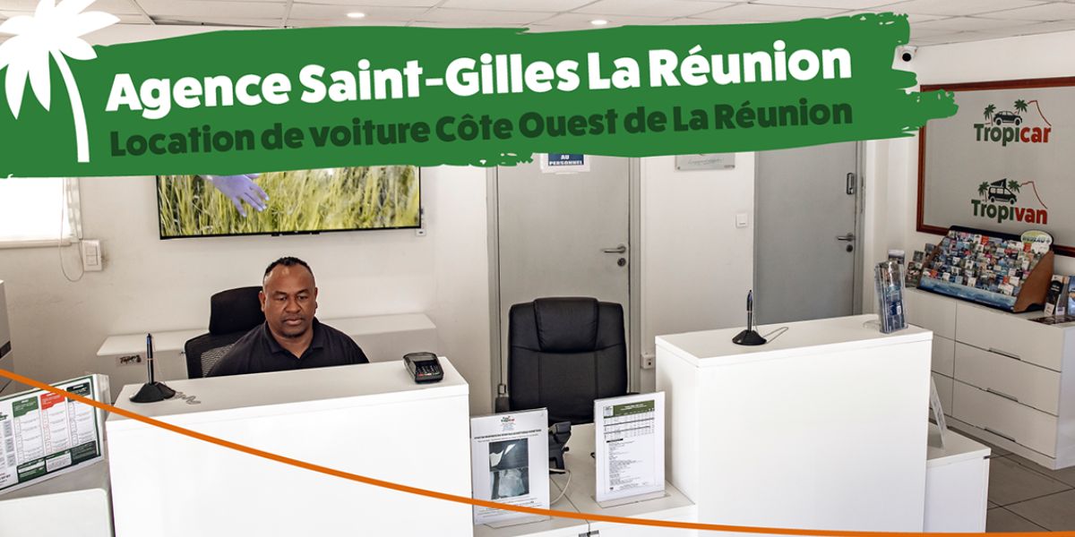 Un agent Tropicar propose des offres de location de voiture à prix avantageux dans l'agence de Saint-Gilles-les-Bains à La Réunion